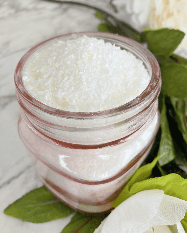 rose bath salts in a pink glass jar