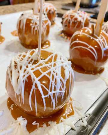 gourmet caramel apples with white drizzle