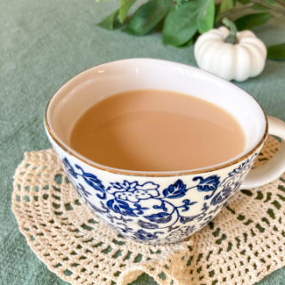 cup of vanilla honey tea on a doilies